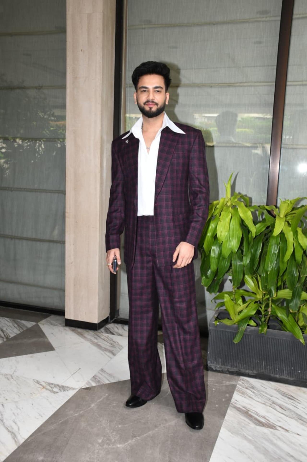 Elvish Yadav was spotted promoting Playground in a sharp maroon checkered suit paired with a crisp white shirt and black shoes.